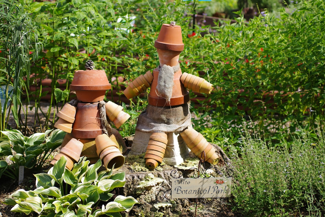 A couple of clay pots sitting on top of a garden